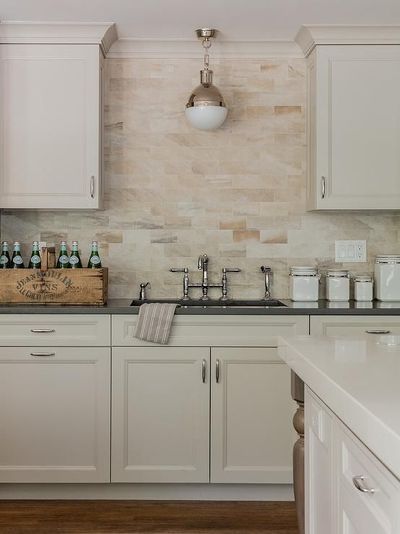 It’s hard not to love the timeless appeal of white cabinets. Not only has white remained the most popular cabinet color for years, it has the added benefit of matching just about any kitchen decor. That means the options are quite literally limitless when searching for the perfect kitchen backsplash for white cabinets. We're going over the best backsplash ideas for white cabinets in our latest blog. #whitecabinets #kitchenbacksplash #modernbacksplash #backsplashideas #shakercabinets Backsplash Ideas White Cabinets, Kitchen Backsplash Ideas White Cabinets, Backsplash Ideas For White Cabinets, Tan Tile, Tan Kitchen, Kitchen Backsplash Tile Designs, Backsplash For White Cabinets, Backsplash Tile Design, Cheap Farmhouse Decor