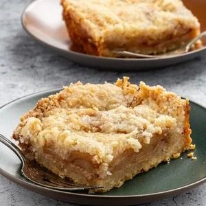 Apple Bars Recipe: How to Make It Apple Kuchen Recipe, Apple Bar Recipes, Apple Crumble Topping, Old Fashioned Apple Pie, Buttery Cookie, Apple Slab Pie, Apple Pie Bars, Apple Cakes, Apple Bars