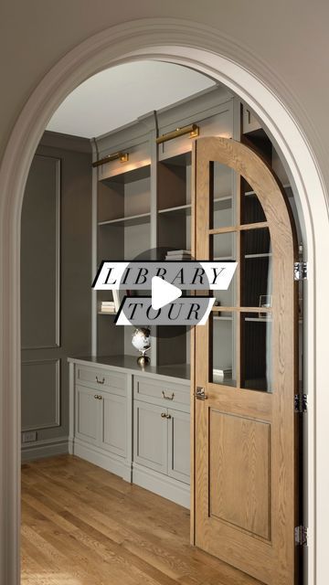 Melissa Manzardo Hryszko on Instagram: "Walk through the custom-arched white oak French doors into the cozy and inviting library. With applied wall moulding, exquisite millwork, and charming accent lights, this is a space our clients can cozy up in with a great book.  And did you notice the plugs and switches? We lucked out and sourced a colour from @lutronbydesign that matched the wall colour almost perfectly.   #library #homelibrary #homeoffice #arch #housegoals #dreamhome #instahome #briarhillcustom" Arched Office Doors, Arched Glass Pocket Doors, Library French Doors, Arched Pocket Doors, Office French Doors Study, Arch French Pocket Door, French Study, Arched Double Doors Interior, Arch Pocket Sliding Door