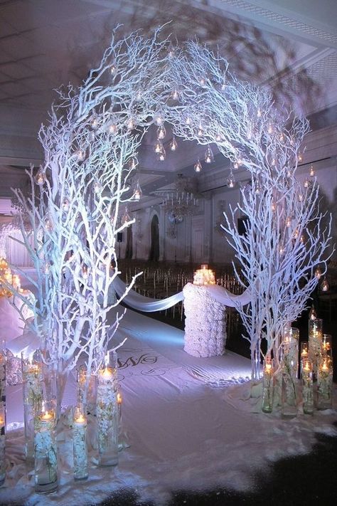 This unique design is stylish and perfect for the winter wedding. The wooden sticks painted white and candles in the jars with hanging bulbs on the arch.#Wedding Walkway Ideas indoor,#Wedding Walkway Ideas pathways,#Wedding Walkway Ideas outdoors,#Wedding Walkway Ideas entrance Winter Wedding Decorations Diy, Winter Wonderland Wedding Decorations, Wonderland Wedding Decorations, Diy Winter Wedding, Wonderland Wedding Theme, Wonderland Party Decorations, Winter Wonderland Decorations, White Branches, Rustic Wedding Decorations