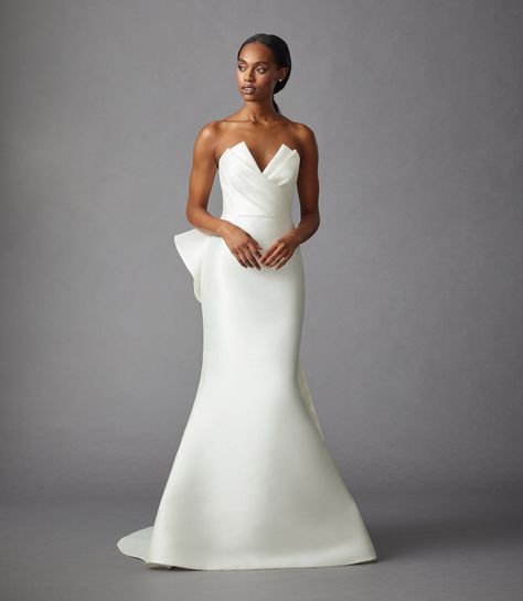 Style  42310 Parker Dress and Bow Allison Webb bridal gown - Ivory blended Dupioni trumpet gown with architectural, origami-pleated bodice, natural waist, sweep train and asymmetrical, detachable bow. Boston Wedding Dress, Allison Webb, Wedding Atelier, Jlm Couture, Flare Wedding Dress, Kleinfeld Bridal, Parker Dress, Fit And Flare Wedding Dress, Trumpet Gown