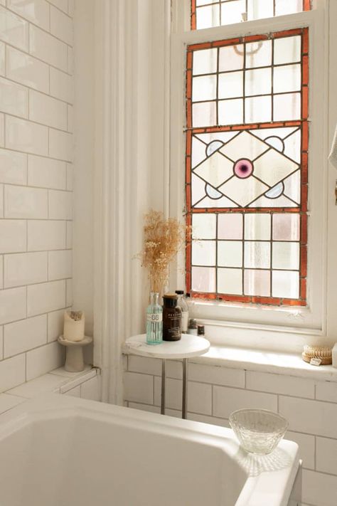 50 Small Bathroom Ideas to Zhuzh Your Tiny Space | Apartment Therapy Faux Window Bathroom, Bathroom With Stained Glass Window, Stained Glass Windows In Bathroom, Privacy Bathroom Window, House With Stained Glass Window, Stained Glass Bathroom Door, Bathroom Stained Glass Window, Stained Glass In Bathroom, Stained Glass Window Bathroom