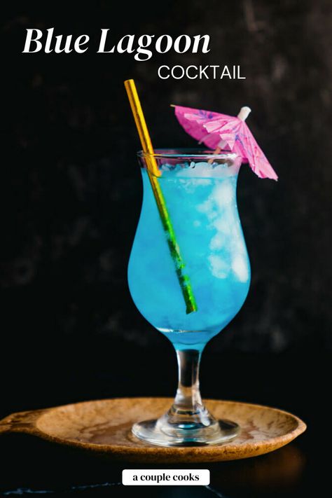 The Blue Lagoon cocktail is an easy and refreshing blue drink! Blue curacao, vodka and lemon make the bright color and citrusy flavor. #blue #bluelagoon #bluecocktail #bluelagooncocktail #bluedrink #bluecuracao Blue Lagoon Drink, Blue Hawaiian Drink, Curacao Drink, Colourful Cocktails, Friday Cocktails, Blue Curacao Drinks, Blue Lagoon Cocktail, Hawaiian Drinks, Flavored Lemonade