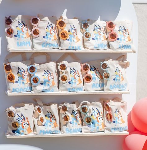 Bluey-themed party favors featuring Bluey characters Bluey Party Bag Ideas, Bluey Party Favors Free Printables, Bluey Daisy Party, Bluey Favor Bags, Bluey Birthday Party Table, Bluey Goodie Bags, Bluey Birthday Favors, Bluey Party Favor Ideas, Adopt A Floppy Bluey Party