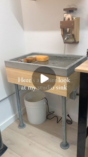 Erin Killian Pottery on Instagram: "My homemade sink has been a studio game changer! We don’t have ground water so this has been our solution. When I posted a mini video, I got a lot of questions, so here’s a closer look. My husband cast the cement and build the wooden base both for the sink and the water canister mounted to the wall. I hope this helps someone! #studio #artstudio #ceramicstudio #oppositesattract #potterystudio #organized #timesaver #organizedspace #organized #organizeyourlife #organizedliving #potterytools #sink #clean #homemade" Mini Pottery Studio, Pottery Sink, Clay Sinks, Water Canister, Kids Art Studio, Ground Water, Mini Video, Countertop Options, Art Studio Room