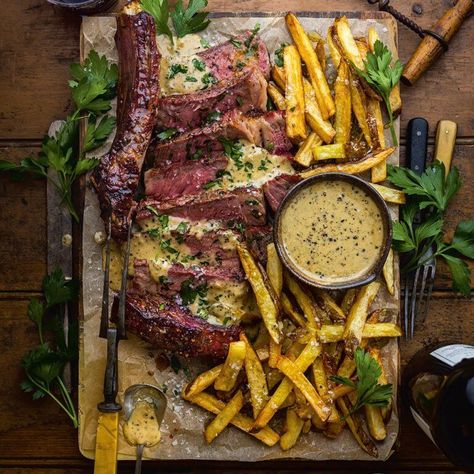 Steak Frites With Whisky-Peppercorn Sauce Recipe | Elle Gourmet Le Entrecote Sauce Recipe, French Steak Frites Recipe, Whisky Peppercorn Sauce, Whiskey Steak Sauce, Fancy Beef Recipes, Steak And Frites Paris, Steak Frites Sauce, French Steak Recipe, Whiskey Peppercorn Sauce For Steak