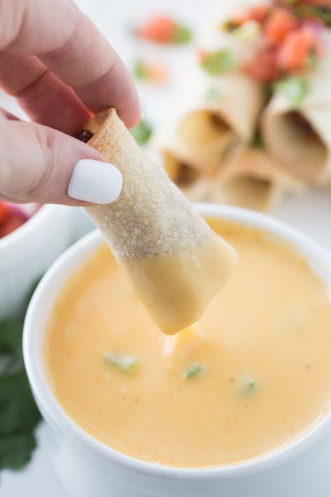 This easy Taquitos recipe uses my favorite hidden veggie taco meat and my favorite homemade cheese sauce as a queso dipping sauce. These gluten-free taquitos, or rolled tacos, are a healthier option than traditional taquitos because they are baked or air fried. Freeze taquitos for an easy lunch, dinner, or snack! Taquito Sauce Recipe, Easy Taquitos, Easy Cheese Sauce, Rolled Tacos, Confessions Of A Fit Foodie, Gluten Free Tacos, Taquitos Recipe, Homemade Cheese Sauce, Veggie Tacos