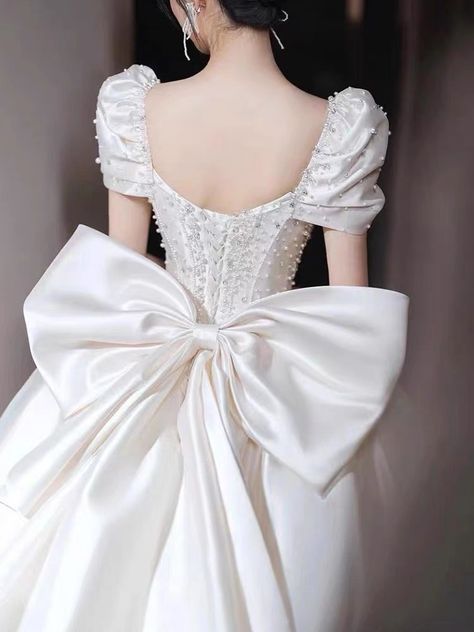 Big bow wedding dress Wedding Gowns With Bows, Wedding Gown With Pearls, Big Bow Wedding Dress, White Princess Dress With Bow, Huge Bow Dress, Wedding Dresses Bow, Wedding Dresses With Big Bows On Back, Wedding Dresses With Bows, Wedding Dress With Big Bow