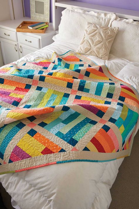 Warm and cool prints create contrast in this throw-size quilt pattern. Use batik fabrics for an exciting finish and a scrappy binding to complete the look. Prairie Quilt, Haida Gwaii, Applique Art, Colorful Quilt, Quilt Pattern Download, Quilt Modernen, Quilting Notions, Jelly Rolls, Jellyroll Quilts