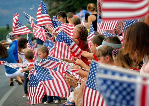 People wave flags as the Independence Day parade rolls down Main Street, July 4, 2014, in Eagar, Ariz. Independence Day Activities, Don Delillo, Independence Day Parade, Us Independence Day, 4th Of July Photos, 4th Of July Parade, American Flags, Patriotic Party, Party Pictures