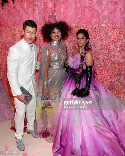 Nick Jonas Pictures and Photos - Getty Images Gala Pictures, Nick Jonas Priyanka Chopra, Nick Jonas Pictures, Purple Gown, Sister Poses, Bridal Necklace Designs, Silver Gown, Lilly Singh, Purple Gowns