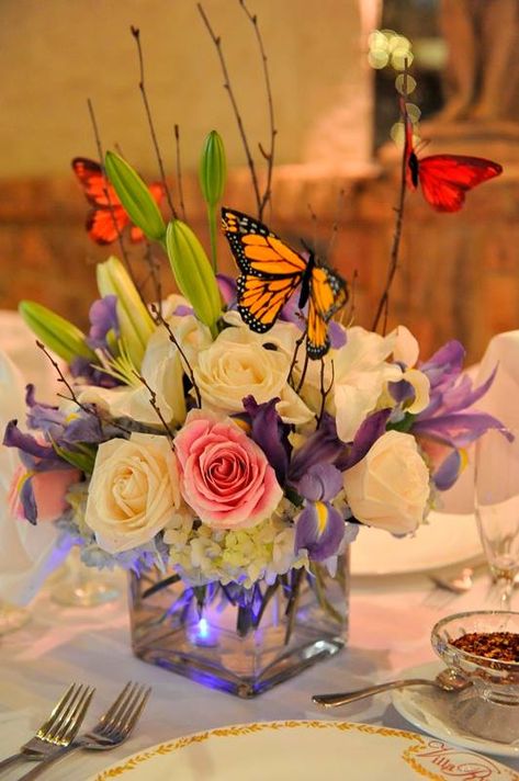 Brighten up your wedding tables with blooms and butterfly centerpieces! Aren't these lovely?  We are ready to host your big day: http://villarussocatering.com/  . . . . .  #wedding #weddingplanning #weddingdecor #reception #weddingreception #centerpiece #weddingcenterpiece #villarusso #nycvenue #gettingmarried Butterfly Flower Centerpiece Ideas, Quince Decorations Flowers And Butterflies, Quince Center Piece Ideas Butterfly, Sweet 16 Table Centerpieces Butterfly, Live Butterfly Centerpiece, Butterfly Wedding Centerpieces, Butterfly Table Decorations, Butterfly Wedding Theme, Butterfly Themed Birthday Party