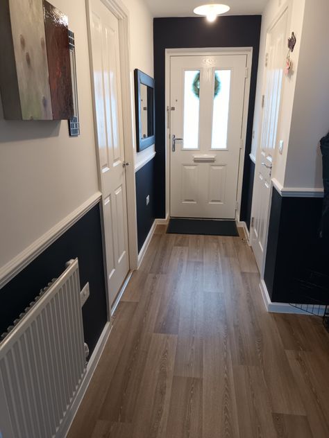 Hall in dark navy and white. Loving the result. Hall With Dado Rail, Hall Dado Rail Hallways, Painted Dado Rail Hallway, Hallway Ideas With Dado Rail, Hallway Panelling Black, Dado Rail Decorating Ideas, Blue Panelling Hallway, Dado Hallway, Floorboards Hallway