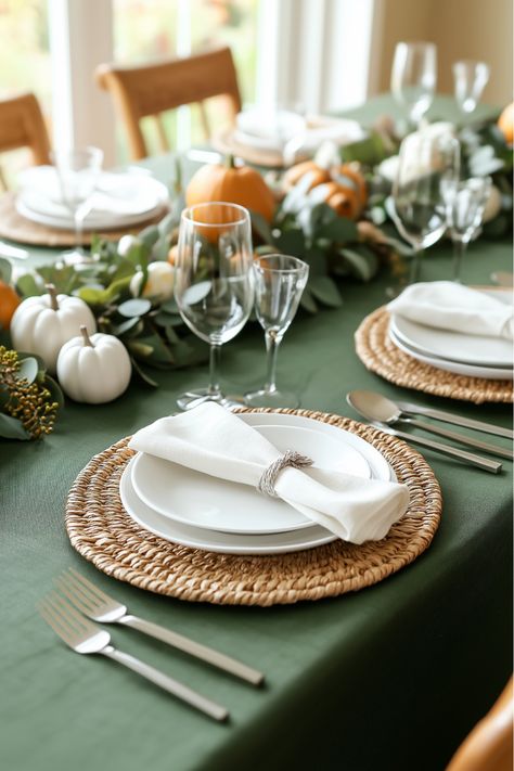 Set a stylish Sage Green Thanksgiving Table with the perfect touch of white pumpkins for a charming and elegant holiday look! 🎃🍂 This tablescape combines a rich sage green tablecloth with natural woven placemats, delicate white pumpkins, and fresh greenery, creating a balanced and inviting atmosphere for your Thanksgiving gathering. Perfect for those who love a modern rustic feel, this decor idea brings warmth, style, and a cozy fall vibe to your holiday table! Sage Green Table Decor, Green Table Decor, Sage Green Table, Thanksgiving Table Setup, Thanksgiving Gathering, Green Tablecloth, Thanksgiving Tablescape, Holiday Tablescapes, Thanksgiving Tablescapes