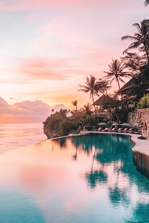 A stunning infinity pool at a Bali hotel, seamlessly blending with the ocean horizon and offering a perfect tropical escape. Bali Travel Aesthetic, Hotels In Bali, East Kalimantan, Unique Vacation Rentals, Infinity Pools, Bali Resort, Unique Vacations, Destin Hotels, Family Friendly Hotels