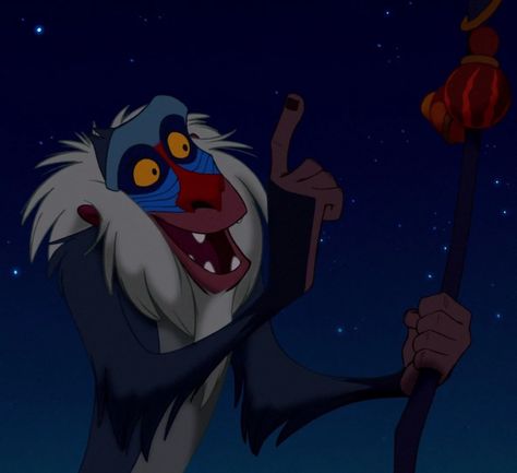 Rafiki is a supporting character in Disney's 1994 animated feature film The Lion King. He is a mandrill who serves as a shaman and Royal Mjuzi of the Pride Lands. Rafiki has an eccentricity that paints him as something of a lunatic; in truth, he is a sage with a deep connection to magical and spiritual elements. With his bakora stick always on his person, Rafiki uses his wisdom to guide those in need, most notably Simba. 1 Background 1.1 Personality 1.2 Physical Appearance 2 Appearances 2.1 The Disney Character Names, Rafiki Lion King, Timon And Pumba, Lion King Ii, Lion King Disney, Lion King Timon, Young Simba, Lion King 1, James Earl Jones