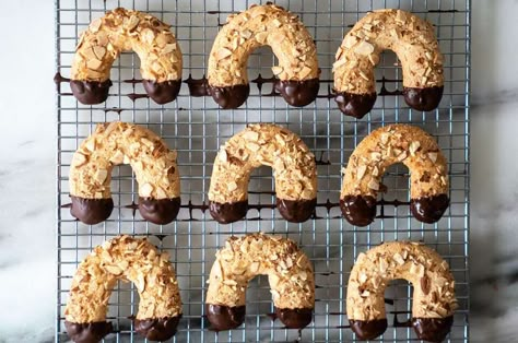 Mandelhörnchen (Almond Horns) | King Arthur Baking: These chewy almond cookies are topped with slices of toasted almonds and dipped in chocolate, making the ultimate treat. Almond Horn Cookies, Almond Horns, Chewy Almond Cookies, Horn Cookies, Cloud Cookies, Icebox Cookies, King Arthur Baking, Dipped In Chocolate, Chocolate Making