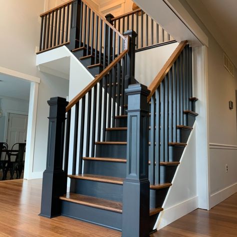 Oak stairs stained with Minmax English Chestnut with off-black wooden balusters and post. Black Wood Banister, Black Wooden Railing Stairs, Black And Wood Bannister, Wooden Stairs Ideas Modern, Black Bannisters And Spindles, Black Wooden Stair Railing, Black Stair Banister Ideas, Stain Staircase, Staircase Makeover Wood