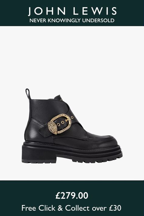 This Mayfair Chunky Ankle Boot from Kurt Geiger London features a black leather upper. There is a statement strap across the foot that is fastened with antiqued brass buckle finished with eagle head.