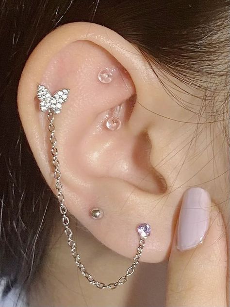 ear piercings earing making ideas earing inspiration Ear Stacking Ideas Grunge, Left Ear Piercing Ideas, Right And Left Ear Piercings, Feminine Ear Piercings, Ear With Lots Of Piercings, Multiple Earrings Inspiration, Peircings Women Ear, Ear Perching, Ear Piercing Set Up