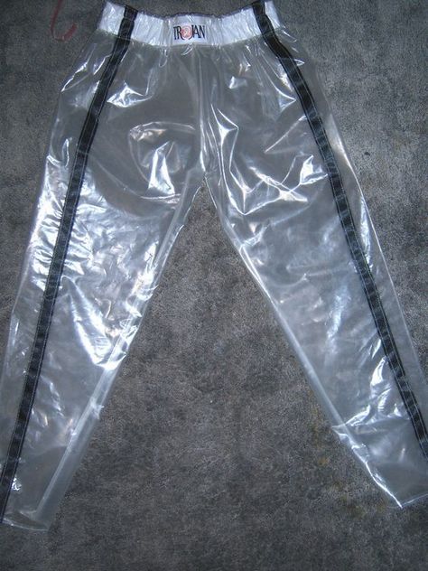 Clear vinyl athletic-style pans with black vertical stripes.. DIY the look yourself: http://mjtrends.com/pins.php?name=clear-vinyl-for-pants #RaincoatsForWomenBlue Clear Pants, Pvc Trousers, Plastic Outfit, Peter Jensen, Plastic Fashion, Waterproof Jacket Women, Plastic Fantastic, Cargo Jogger Pants, Blue Raincoat