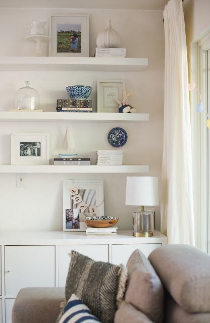 Ikea Floating Shelf Built Ins: Living Room Update Ikea Floating Bookshelves, White Floating Shelves Office, Ilea Floating Shelf, White Floating Bookshelves, White Floating Shelves Living Room Tv Units, Ikea White Floating Shelf, Ikea Floating Shelves, Floating Books, Living Room Classic