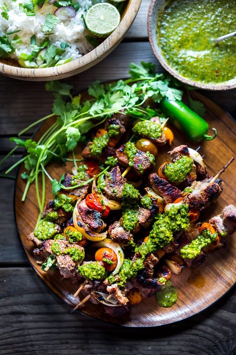 Grilled Chilean Beef Kabobs with Chimichurri Sauce and Cilantro Rice. An easy flavorful weeknight meal. | www.feastingathome.com #beef #skewers #chimichurri #grilling #kabobs #beefkabobs Feasting At Home, Canh Chua, Fruit Kebabs, Cilantro Rice, Beef Kabobs, Beef Skewers, Kebab Recipes, Chimichurri Sauce, Wooden Plate