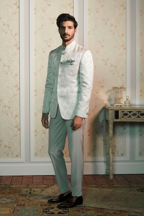 Inspired from exotic cultures, the #Bandhgala exudes royal extravagance. Spark the #celebrations with contemporary Bandhgalas from the #RaymondCeremonial collection!  The Ensemble: Matte silver Bandhgala with jacquard motifs. Reception Dress For Men, Raymond Shop, Indo Western Outfits For Men, Engagement Dress For Men, Formal Dress For Men, Wedding Outfits Indian, Wedding Kurta, Wedding Kurta For Men, Indian Wedding Outfit