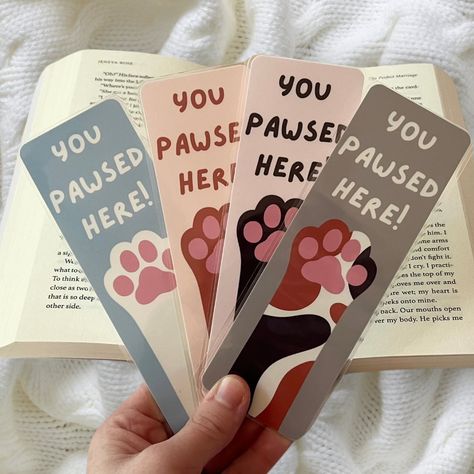 Happy #nationalbookloversday ! I’m so happy that I’m releasing my bookmarks on this day!!! Here’s one of my themes , I also have this available in doggy paws as well! These are completely handmade , hand drawn , and made with love! They’re laminated for extra protection as well 🩷 Share this with someone who loves cats!!! . . . #bookmarkshop #bookmarkart #catloverclub #bookishgirl #bookishart #bookloversofinstagram #bookstagram Laminate Bookmark, Cat Bookmark, Handmade Bookmarks Diy, Bookmark Ideas, Bookmarks For Books, Creative Bookmarks, Bookmark Craft, Doodles Drawings, Bookclub Gifts