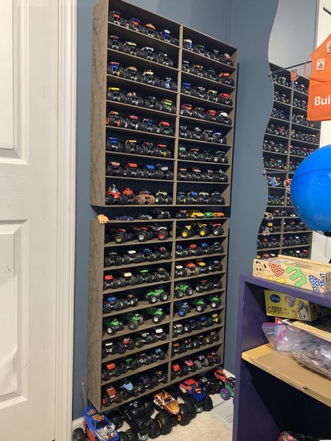 Toy Storage For Large Trucks, Monster Truck Garage Diy, Monster Jam Storage Ideas, Monster Truck Toy Storage Ideas, Monster Trucks Storage Ideas, How To Store Monster Trucks, Monster Truck Wall Storage, Monster Jam Room Decor, Diy Monster Truck Storage