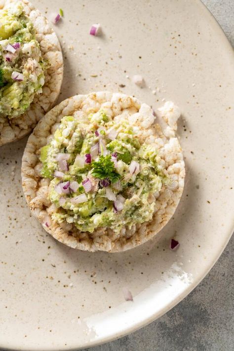 Healthy snack. Rice cake with avocado and tuna salad with red onion. royalty free stock photos Rice Cake Recipes Healthy, Crispy Rice Cakes, Avocado And Tuna, Salad With Red Onion, Rice Cakes Toppings, Rice Cakes Healthy, Tuna Lunch, Rice Cake Snacks, Tuna Rice