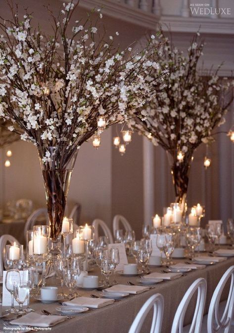 Styling a winter wedding - white blossom trees and candles Amazing Wedding Centerpieces, Used Wedding Decor, Branch Centerpieces, Winter Wedding Centerpieces, Tafel Decor, Winter Wedding Decorations, Wedding Floral Centerpieces, Wedding Table Decorations, Wedding Table Centerpieces