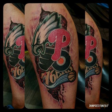 Philly sports color realism tattoo by Don Preston Eagles flyers 76ers Phillies realistic logo leg tattoo arm tats Philadelphia pride sports fan ink tatts basketball hockey baseball football lovers tattoos Philadelphia Eagles Tattoo Ideas, Philadelphia Eagles Tattoo For Women, Nfl Tattoo Ideas, Phillies Tattoo Ideas, Philly Sports Tattoo, Philadelphia Tattoo Ideas, Philly Tattoo Ideas Philadelphia, Philly Tattoo Ideas, Lost Soul Tattoo