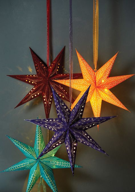 An attractive piece of contemporary décor, this 7-arm hanging star decoration has a velvet texture. A surface pattern suggests a shine and has a glitter finish with a mounting ribbon. Powered by battery operated LED's with timer function. Requires 3 AA batteries not included. 60cm Recycled Hand Made Paper from cotton waste Made with recycled hand crafted paper from 100% cotton waste. The process is environmentally friendly, involving no wood or acid and therefore no harmful discharges to the local environment. Star Lantern, Glitter Pattern, Hanging Stars, Star Lanterns, Velvet Texture, Stationery Craft, Star Decorations, Light Shade, Dream House Decor