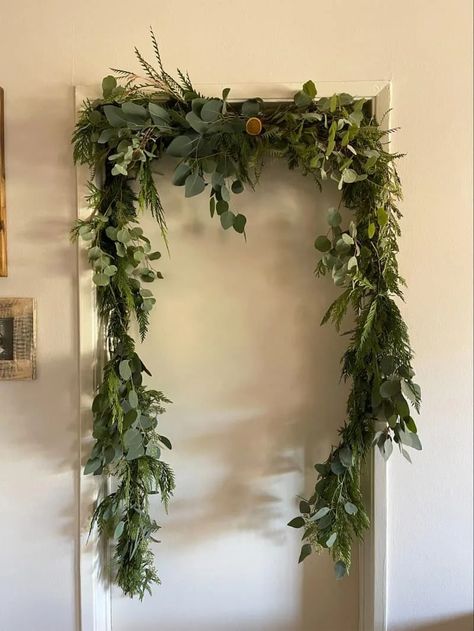 Garland On Doorframe, Tension Curtain Rods Ideas, Door Frame Garland, Tension Rod Garland Hack, Christmas Garland On Curtain Rod, Shower Curtain Rod Garland, Tension Rod Ideas Christmas, Shower Rod Garland, How To Hang Garland On Wall