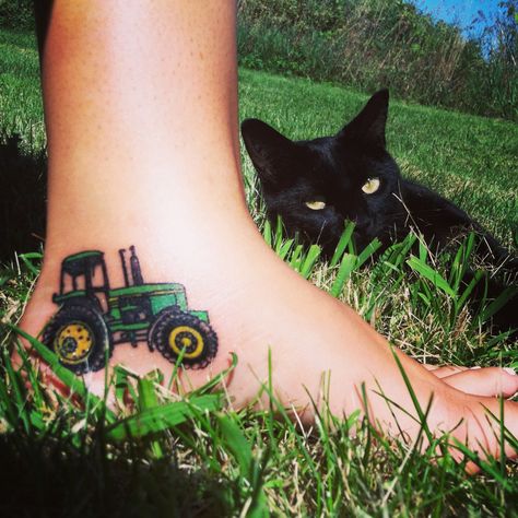 I will never forget where I came from. My first tattoo I grew up on a dairy farm and Ive spent many hours in that tractor with beloved family members. Also my kitty Lola got in the picture. #tattoo #tractor #country Minimalist Tractor Tattoo, Farm Life Tattoo Ideas, John Deer Tattoo, Farming Tattoos Ideas, Tractor Tatoos, Small Tractor Tattoo, Tractor Tattoo Memorial, Tractor Tattoo, Farm Tattoos