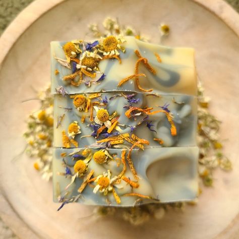 Lovely Chamomile Soap, made with a chamomile tea infusion that calms skin redness (rosacea) and soothes irritated skin (eczema, dermatitis). Chamomile has anti-inflammatory and antimicrobial properties, making it helpful for inflamed skin, including acne. It's safe to use on the face and has an abundant lather that comes from the inclusion of aqua faba. This is on my farmer's market table and on my website (link in bio). LIKE and FOLLOW @bluejewelhandcraftedsoap. I would really appreciate... Aqua Faba, Chamomile Soap, Tea Infusion, Inflamed Skin, Market Table, Botanical Skincare, Skin Redness, Chamomile Tea, Handcrafted Soaps