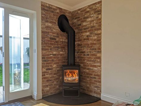 Gas Stove Fireplace Brick, Brick Slip Fireplace Ideas, Wood Burner In Corner Of Room, Brick Around Wood Stove, Brick Fireplace Wood Stove, Wood Stove Slate Surround, Tiles Behind Stove Wood Burning, Adding A Wood Stove To Living Room, Woodburner Hearth Ideas