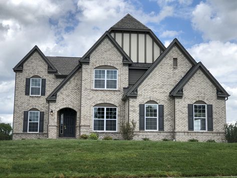 LOGAN CANYON BRICK, TERRATONE TRIM, ARCTIC WHITE STUCCO, TIMBERBARK BATTEN STRIPS (HH 01) Cream City Brick House Exterior, White Brick House Taupe Trim, Limewash Brick Exterior Tudor, Brown Brick Tudor Exterior, Logan Canyon Brick, White Window Trim, Brick House Colors, House Brick, Light Window