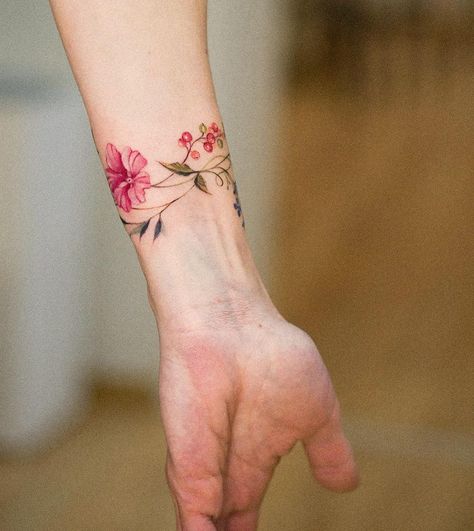 Veronika on Instagram: "Floral bracelet @truecanvas #floraltattoo #bracelettattoo #watercolortattoo #flowerstattoo #botanicaltattoo #naturetattoo #flowertattoo…" Poppy Flower Bracelet Tattoo, Floral Wristlet Tattoo, Wildflower Wrist Bracelet Tattoo, Color Wrist Tattoo, Bracelet Tattoo Color, Tattoo Daisies, Floral Bracelet Tattoo, Flower Bracelet Tattoo, Pols Tattoo