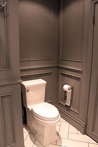 Stunning gray bathroom design features full wall gray wainscoting accented with gray moldings ... Grey Bathrooms Designs, Luxury Townhouse, Bathroom Walls, Wall Molding, Painted Paneling, Grey Bathrooms, Wainscoting, Guest Bathroom, Small Bathroom Remodel