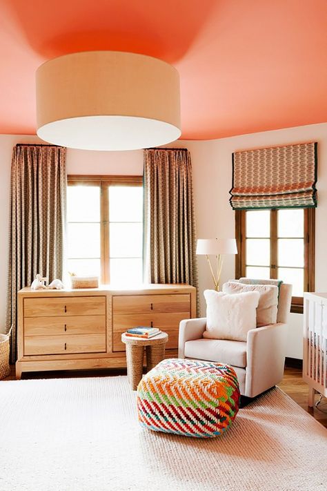 Can't decide what to love most about this modern nursery— the peach painted ceiling, colorful rainbow ottoman cube, or traditional floor-to-ceiling drapes. Disc Interiors, Peach Paint, York Aesthetic, Decor Ikea, Colored Ceiling, Cube Ottoman, Nursery Colors, Painted Ceiling, Baby's Room