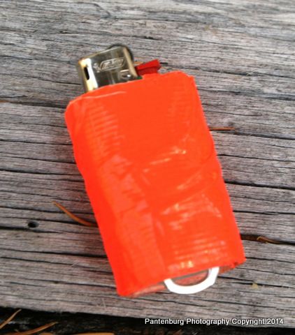 Add several feet of duct tape and a poptop to a standard BIC mini lighter and you have a firestarting kit. Secure the lighter to a lanyard with the poptop. Camping Things, Dr Evil, Survival Fire, Survival Ideas, Outdoor Survival Gear, Survival Stuff, Butane Lighter, Bic Lighter, Zombie Survival