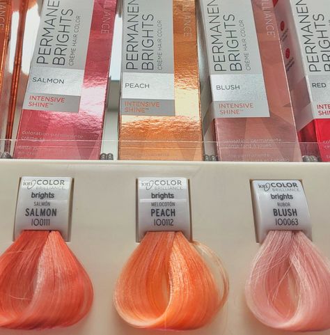 Image of hair swatches at beauty store vsco filter pink, salmon, peach, rose Pastel Peach Hair Dark Roots, Golden Melon Hair Color, Bright Peach Hair, Pastel Peach Hair Color, Watermelon Pink Hair, Peachy Coral Hair, Peach Coral Hair, Salmon Hair Color Peach, Peach Pink Hair Color