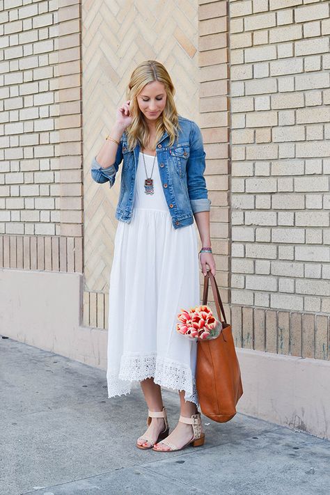 spring bohemian vibe with an airy, white maxi dress Sundress With Denim Jacket, White Dress With Denim Jacket Outfit, White Dress Jean Jacket Outfit, White Dress With Denim Jacket, Dress And Denim Jacket Outfit, Dress And Jacket Outfit, Dress With Denim Jacket, How To Wear Denim Jacket, Dress Denim Jacket