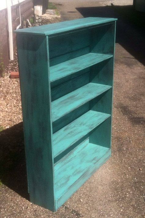 Used scrap wood to build bookshelf painted the base coat dark brown and distressed teal for top coat. Turquoise Bookshelf, Distressed Turquoise Furniture, Teal Bookshelf, Build Bookshelf, Teal Bookshelves, Painted Playhouse, Teal Painted Furniture, Distress Furniture, Turquoise Furniture