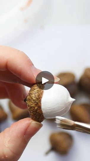 How to Paint an Acorn Garland | photograph | This pretty foraged acorn garland is lovely for a fall mantel or tiered tray! Photos and supply list ->... | By Sustain My Craft Habit - Clever DIY, Crafts & Upcycling IdeasFacebook Painting Acorns Fall, Decorating With Acorns For Fall, Craft With Acorns, Acorn Christmas Ornaments Diy, Crafts Using Acorns, How To Paint Acorns, Acorn Diy Decor Fall Crafts, Painting Acorns Diy, Acorn Christmas Crafts