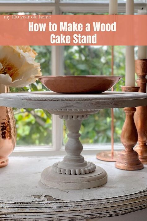 I love this wood cake stand so much. It was such an easy DIY and I think you might want to make one for sure! A few years I bought a wood cake stand that had beading and was painted white. I bought it at Magnolia in Waco and unfortunately they don’t sell it anymore. I get asked about the cake stand all of the time. So I decided to make one! The DIY How to Make a Wooden Cake Stand In the photo below, you can see the cake stand I bought at the Magnolia Market at the Silos. The… Wood Cake Stand Diy, Cake Stand Diy, Wooden Cake Stand, Farmhouse Projects, Diy Cake Stand, Wooden Cake Stands, Wood Cake Stand, Vintage Cake Stands, Wood Cake