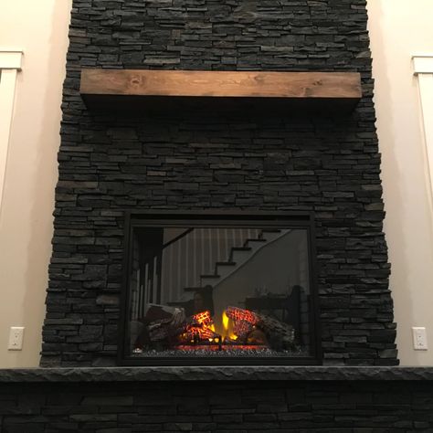 Dark Stack Stone Fireplace, Stone Black Fireplace, Black Ledger Stone Fireplace, Black Stone Fireplace Living Room, Faux Black Brick Wall Living Room, Stacked Stone Fireplaces Rustic, Black Stone For Fireplace, Black Slate Fireplace Wall, Black Fireplace Backsplash