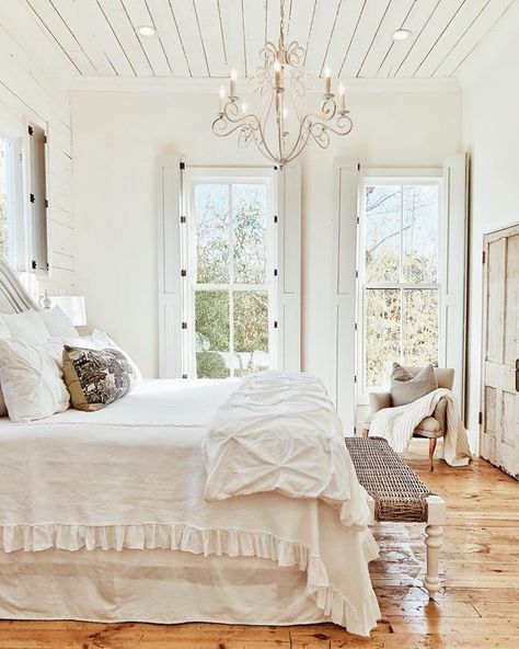 French Farmhouse Bedroom with shiplap ceiling, shutters, chandelier, and rustic wood floors Wood Shiplap Ceiling Bedroom, Vaulted Shiplap Ceiling Master Bedrooms, White Farmhouse Bedroom Furniture Romantic, Modern Farmhouse Bedroom Master Suite Shiplap, Master Farmhouse Bedroom, French Farmhouse Bedroom, Rustic Wood Floors, Shiplap Ceiling, Dream Farmhouse